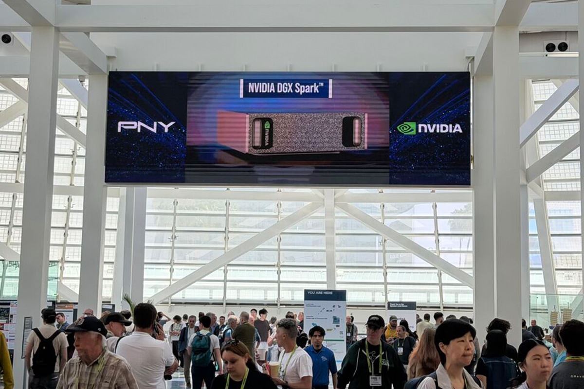 PNY and NVIDIA DGX Spark digital display above a busy conference entrance